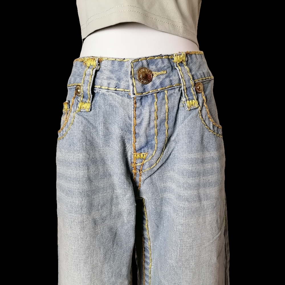 vintage light blue mid rise , wide leg jeans by seven for all mankind